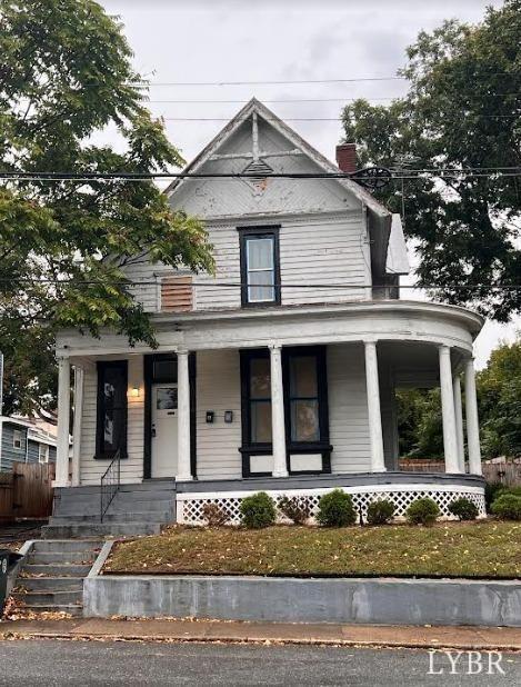 1014 Buchanan St, Lynchburg, VA 24501 - view of front of home with a porch, fence, and a chimney