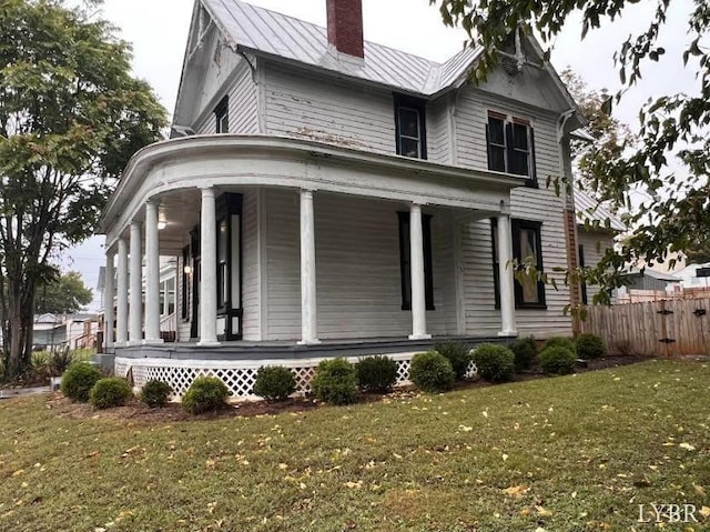 1014 Buchanan St, Lynchburg, VA 24501 - view of home's exterior with a porch, a chimney, a standing seam roof, and metal roof