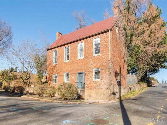 522 Jackson St, Lynchburg, VA 24504 - view of front of home featuring a chimney and brick siding