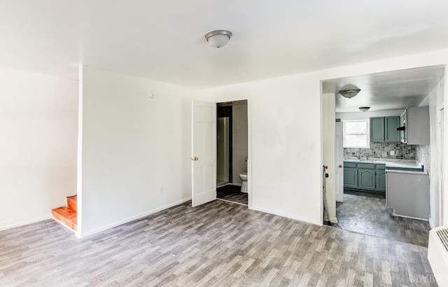 1930 Vine St, Lynchburg, VA 24501 - unfurnished living room featuring baseboards, stairs, and wood finished floors