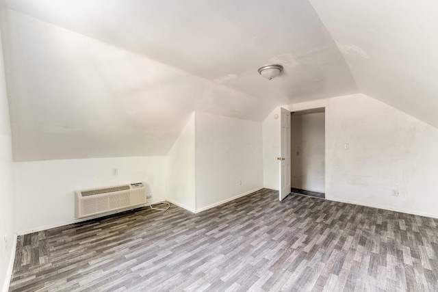 1930 Vine St, Lynchburg, VA 24501 - additional living space with wood finished floors, lofted ceiling, and a wall mounted air conditioner