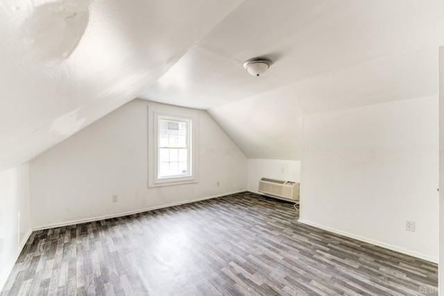 1930 Vine St, Lynchburg, VA 24501 - additional living space with a wall mounted air conditioner, wood finished floors, and lofted ceiling