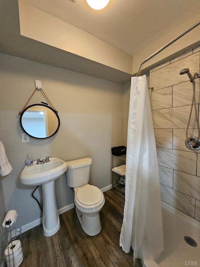 1810 Broadway St Unit 102, Lynchburg, VA 24501 - bathroom with baseboards, wood finished floors, toilet, and a stall shower