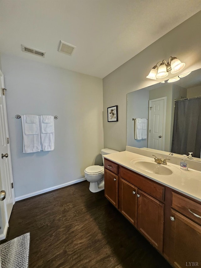 1810 Broadway St Unit 102, Lynchburg, VA 24501 - bathroom featuring baseboards, wood finished floors, visible vents, and vanity