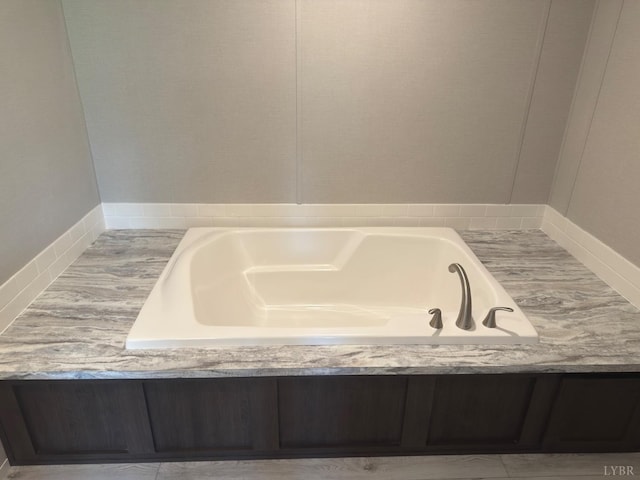 full bathroom with a bath