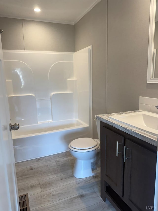 full bathroom with toilet, vanity, shower / bath combination, and crown molding