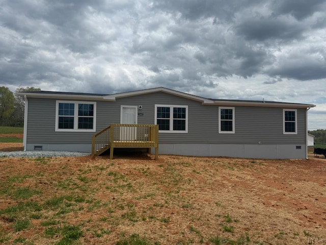 back of house featuring crawl space