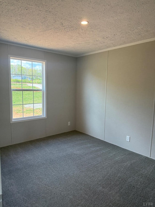 spare room with carpet, a textured ceiling, ornamental molding, and recessed lighting