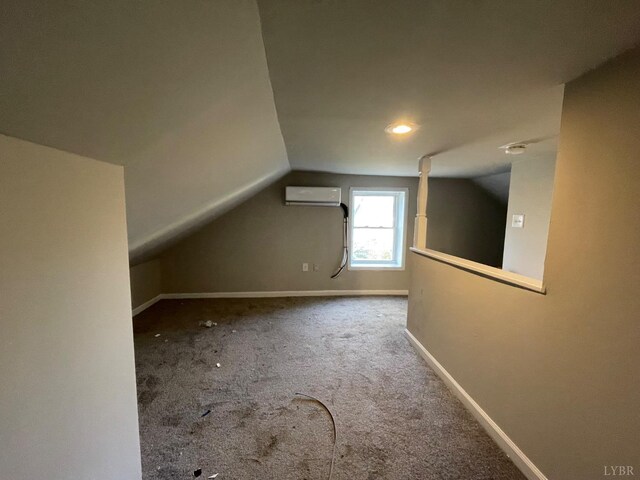 3221 Maryland Ave, Lynchburg, VA 24501 - additional living space with a wall unit AC, vaulted ceiling, carpet, baseboards, and recessed lighting