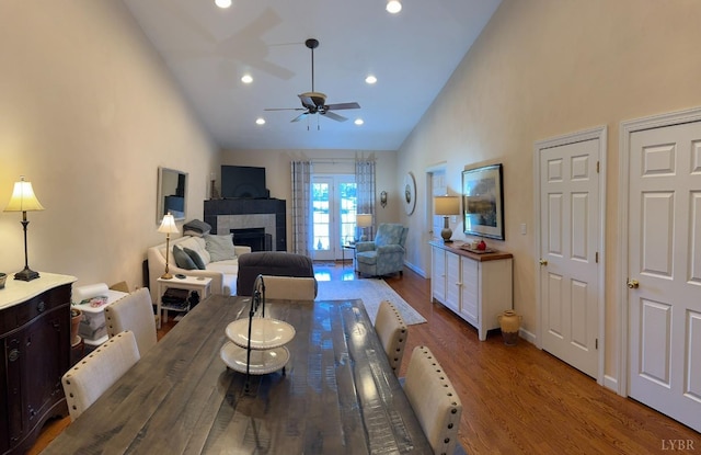 206 Blarney Stone Ct, Huddleston, VA 24104 - dining area with a ceiling fan, high vaulted ceiling, wood finished floors, a tile fireplace, and recessed lighting