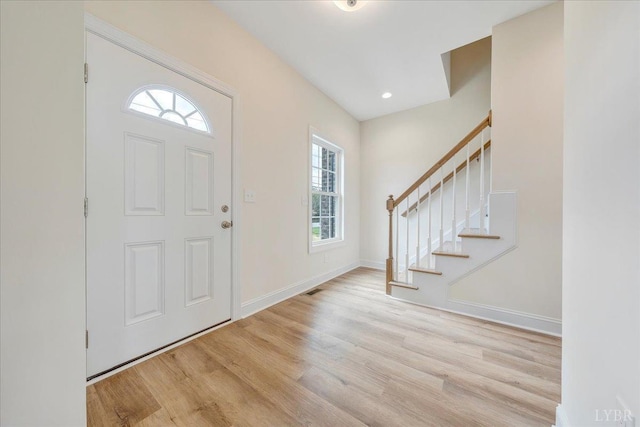 9 Lochwood Hill Dr, Goode, VA 24556 - entrance foyer featuring wood finished floors, stairway, and baseboards