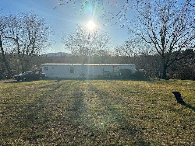 view of property exterior featuring a lawn