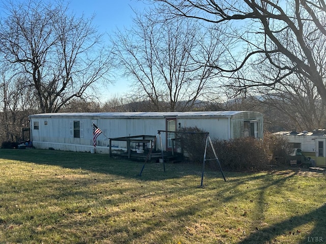 105 Byrnes St, Goodview, VA 24095 - back of house featuring a lawn