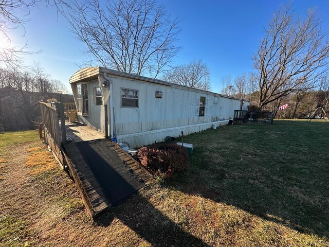 105 Byrnes St, Goodview, VA 24095 - view of side of home with a yard