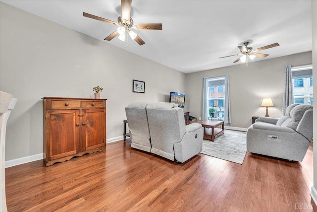 59 Broad St, Daleville, VA 24083 - living room featuring a ceiling fan, baseboards, and light wood-style flooring