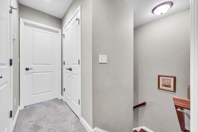 59 Broad St, Daleville, VA 24083 - hallway with carpet flooring, baseboards, and an upstairs landing