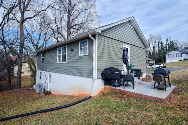 1117 Long Meadows Dr, Lynchburg, VA 24502 - view of side of home featuring a patio area, central AC unit, and a lawn