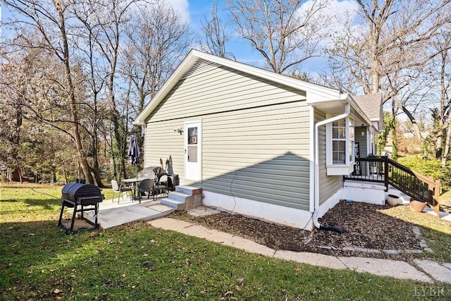 1117 Long Meadows Dr, Lynchburg, VA 24502 - view of side of home with a lawn and a patio