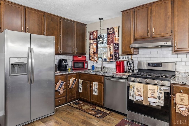 1117 Long Meadows Dr, Lynchburg, VA 24502 - kitchen featuring stainless steel appliances, under cabinet range hood, a sink, dark wood-type flooring, and light stone counters