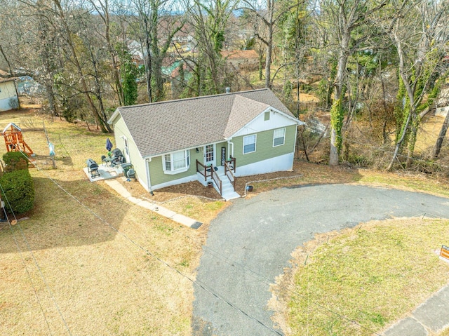 1117 Long Meadows Dr, Lynchburg, VA 24502 - view of front of home featuring asphalt driveway, a shingled roof, a playground, and view of scattered trees