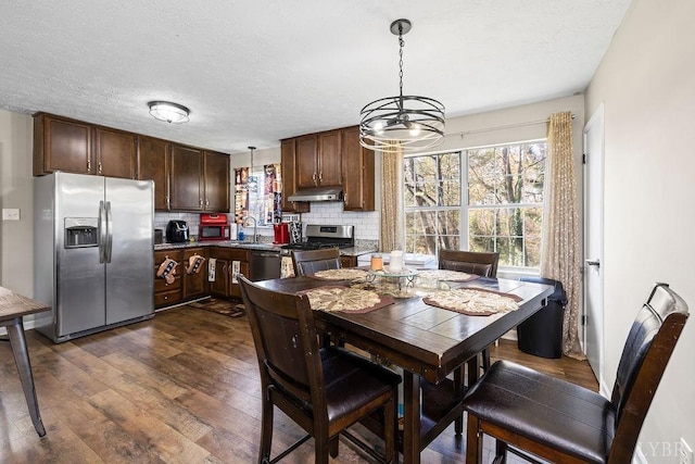 1117 Long Meadows Dr, Lynchburg, VA 24502 - dining area featuring dark wood finished floors, plenty of natural light, a chandelier, and a textured ceiling
