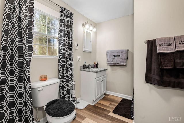 1117 Long Meadows Dr, Lynchburg, VA 24502 - bathroom with wood finished floors, toilet, vanity, baseboards, and curtained shower