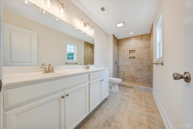 7 Lochwood Hill Dr, Goode, VA 24556 - full bath with double vanity, a tile shower, toilet, tile patterned flooring, and baseboards