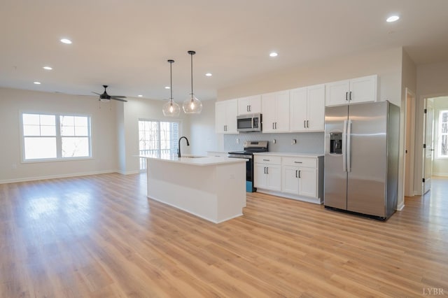 128 Brenleigh Ct Unit 202, Lynchburg, VA 24501 - kitchen featuring stainless steel appliances, light wood-type flooring, recessed lighting, decorative backsplash, and white cabinets