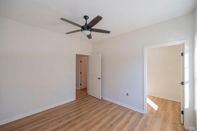 128 Brenleigh Ct Unit 202, Lynchburg, VA 24501 - unfurnished bedroom with light wood-style flooring, a spacious closet, a closet, and baseboards