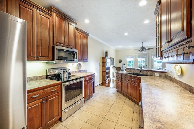 152 Fairwinds Ct, Forest, VA 24551 - kitchen with appliances with stainless steel finishes, a sink, crown molding, recessed lighting, and light tile patterned flooring