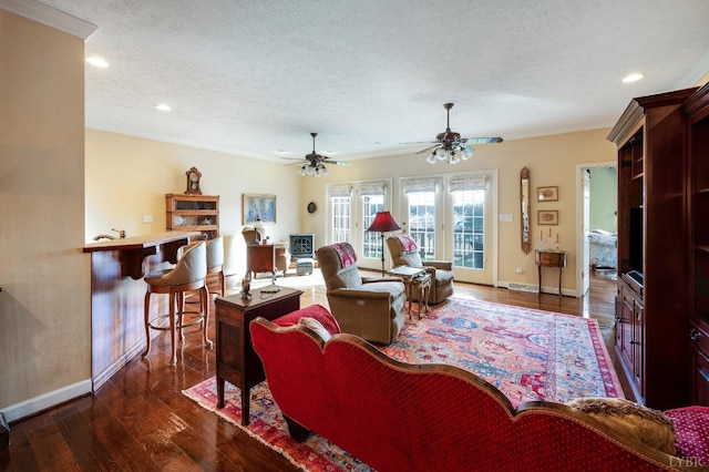 152 Fairwinds Ct, Forest, VA 24551 - living area featuring a textured ceiling, baseboards, crown molding, dark wood-style flooring, and a ceiling fan