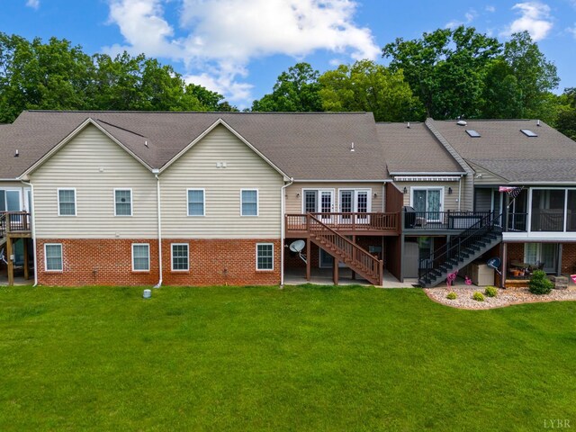152 Fairwinds Ct, Forest, VA 24551 - rear view of house featuring stairway, a wooden deck, brick siding, and a lawn