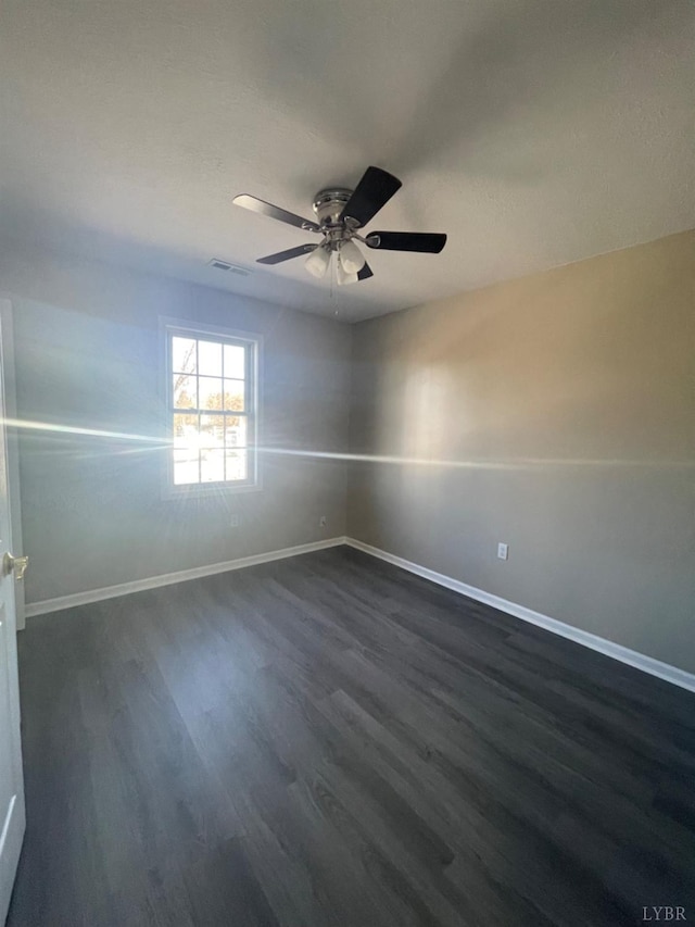 2001 3rd St, Lynchburg, VA 24501 - unfurnished room with dark wood-type flooring, ceiling fan, and baseboards