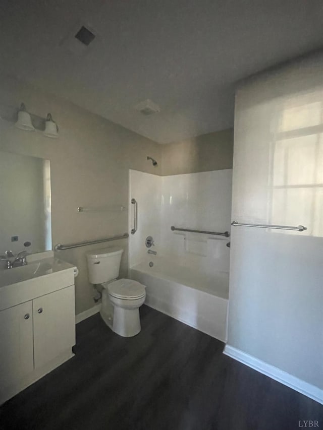 2001 3rd St, Lynchburg, VA 24501 - full bath with toilet, wood finished floors, washtub / shower combination, and vanity