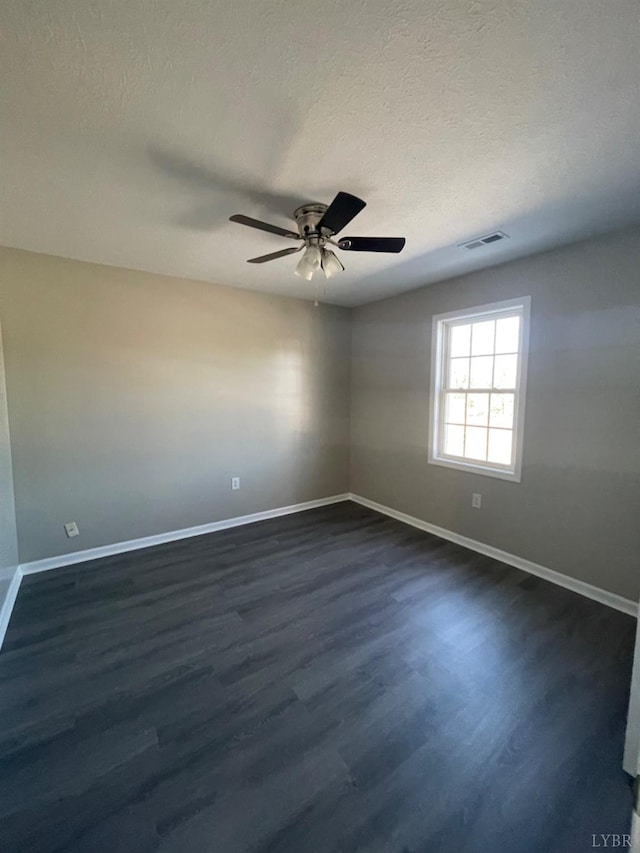 2001 3rd St, Lynchburg, VA 24501 - empty room with baseboards, dark wood-style flooring, a ceiling fan, and a textured ceiling