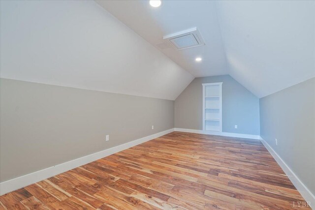 4615 Everett Rd, Forest, VA 24551 - additional living space featuring light wood-type flooring, baseboards, vaulted ceiling, and built in shelves
