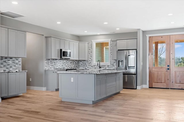 4615 Everett Rd, Forest, VA 24551 - kitchen with light wood-style flooring, visible vents, stainless steel appliances, plenty of natural light, and gray cabinets
