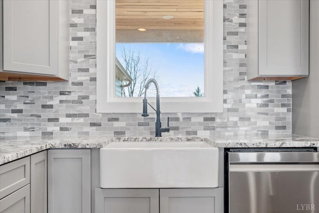 4615 Everett Rd, Forest, VA 24551 - kitchen with light stone countertops, stainless steel dishwasher, backsplash, and a sink