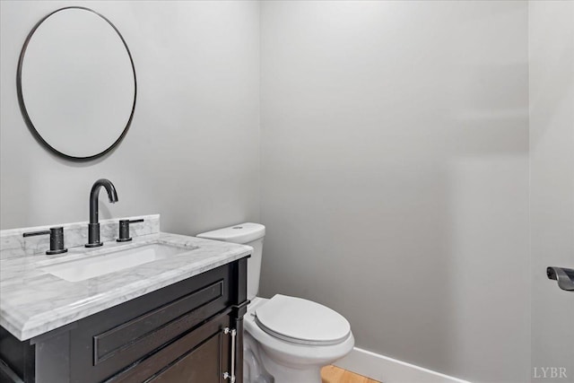 4615 Everett Rd, Forest, VA 24551 - bathroom featuring toilet, vanity, and baseboards