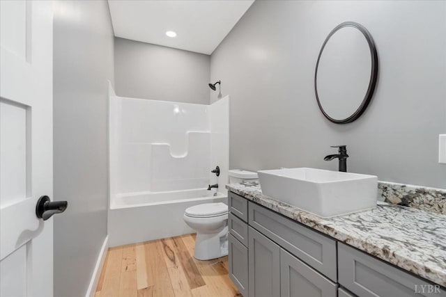 4615 Everett Rd, Forest, VA 24551 - full bath featuring wood finished floors, toilet, vanity, and shower / bath combination