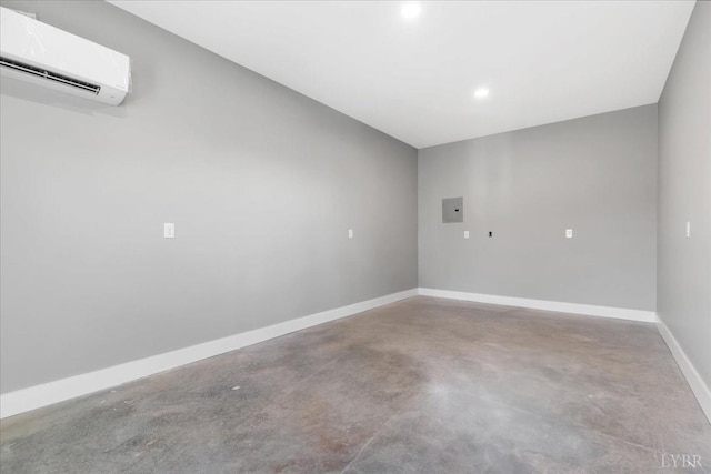 4615 Everett Rd, Forest, VA 24551 - empty room featuring finished concrete flooring, a wall unit AC, electric panel, baseboards, and recessed lighting