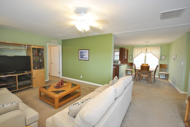 2453 Easome Rd, Hurt, VA 24563 - living room featuring a ceiling fan, carpet flooring, and baseboards