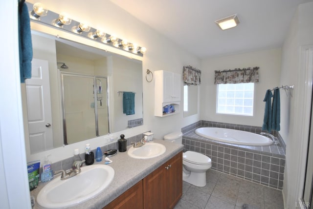 2453 Easome Rd, Hurt, VA 24563 - bathroom with tile patterned floors, a garden tub, a stall shower, toilet, and double vanity