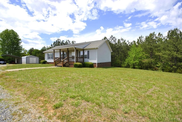 2453 Easome Rd, Hurt, VA 24563 - view of front of house with covered porch, a storage shed, an outbuilding, a detached carport, and a front yard