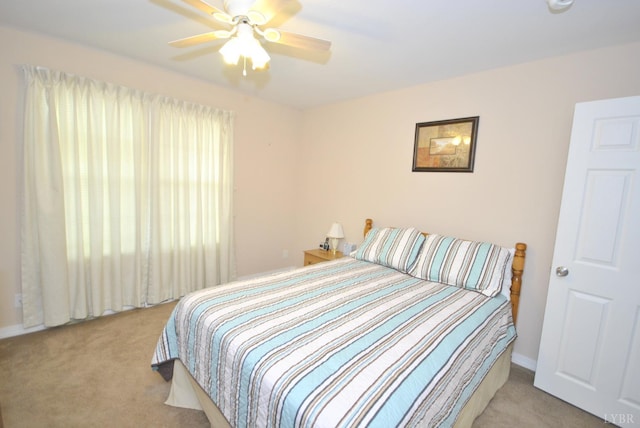 2453 Easome Rd, Hurt, VA 24563 - bedroom with light carpet, a ceiling fan, and baseboards