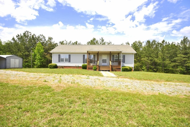 2453 Easome Rd, Hurt, VA 24563 - ranch-style house featuring a shed, an outbuilding, a front yard, and covered porch