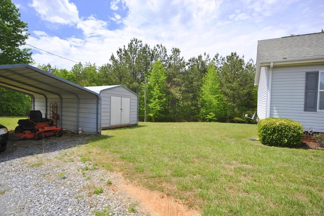 2453 Easome Rd, Hurt, VA 24563 - view of grassy yard with a storage unit, driveway, a carport, and an outdoor structure
