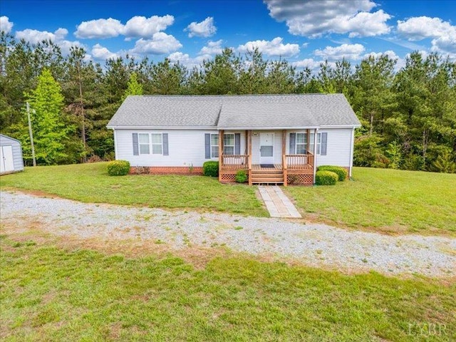 2453 Easome Rd, Hurt, VA 24563 - single story home with a shed, a front yard, an outdoor structure, and a wooden deck