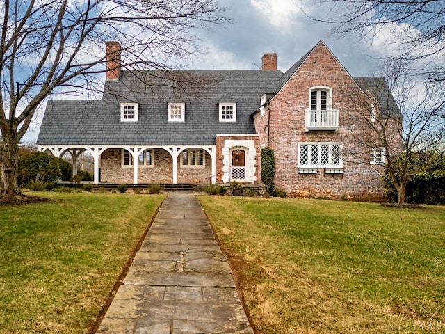 113 Oakwood Pl, Lynchburg, VA 24503 - tudor house featuring a chimney, a front lawn, a high end roof, and a porch