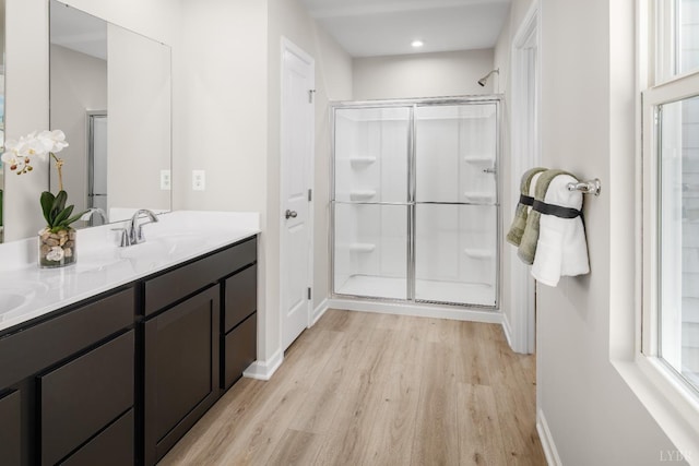 65 Kade Ct, Lynchburg, VA 24502 - bathroom featuring wood finished floors, a shower stall, double vanity, and recessed lighting